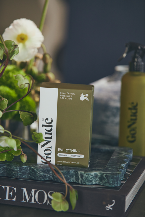 Go Nude Everything Surface Cleaner concentrate and Olive Keeper bottle lifestyle