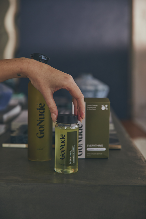 Go Nude Everything Surface Cleaner concentrate and Olive Keeper bottle lifestyle