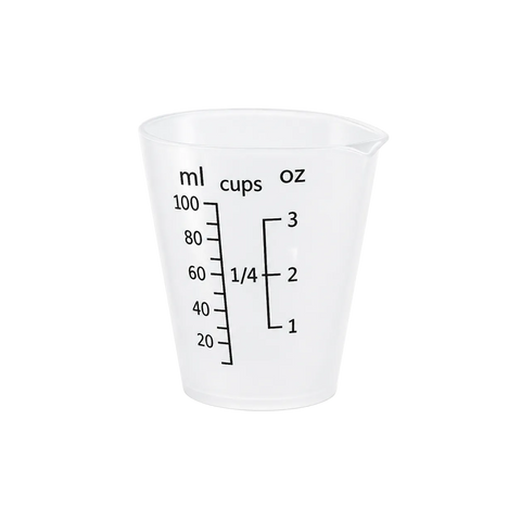 Clear measuring cup with volume markings on a white background
