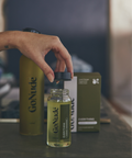 Pouring Go Nude Everything Surface Cleaner concentrate into the Keeper bottle